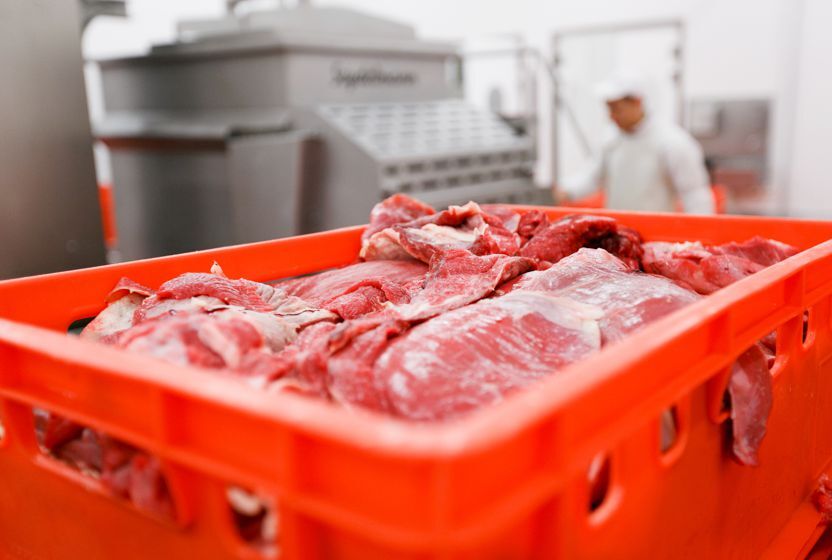E series plastic containers for meat filled with goods in a slaughterhouse.