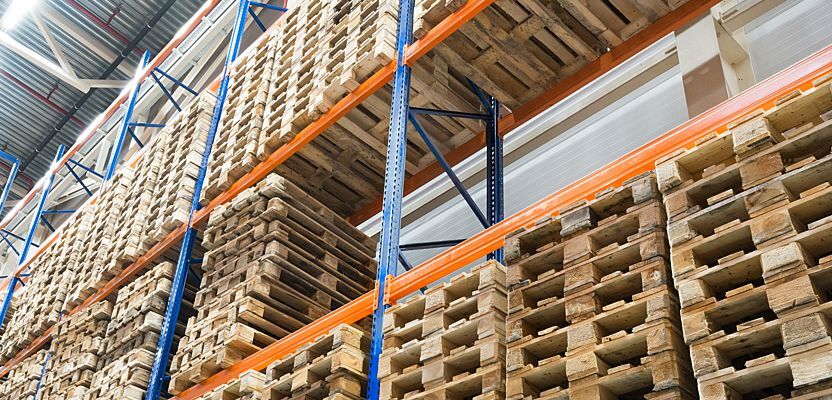 Stack of wooden pallets in the warehouse