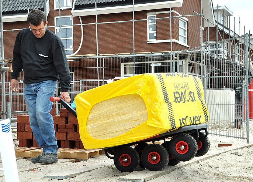 The builder is bringing building materials on a Matador trolley